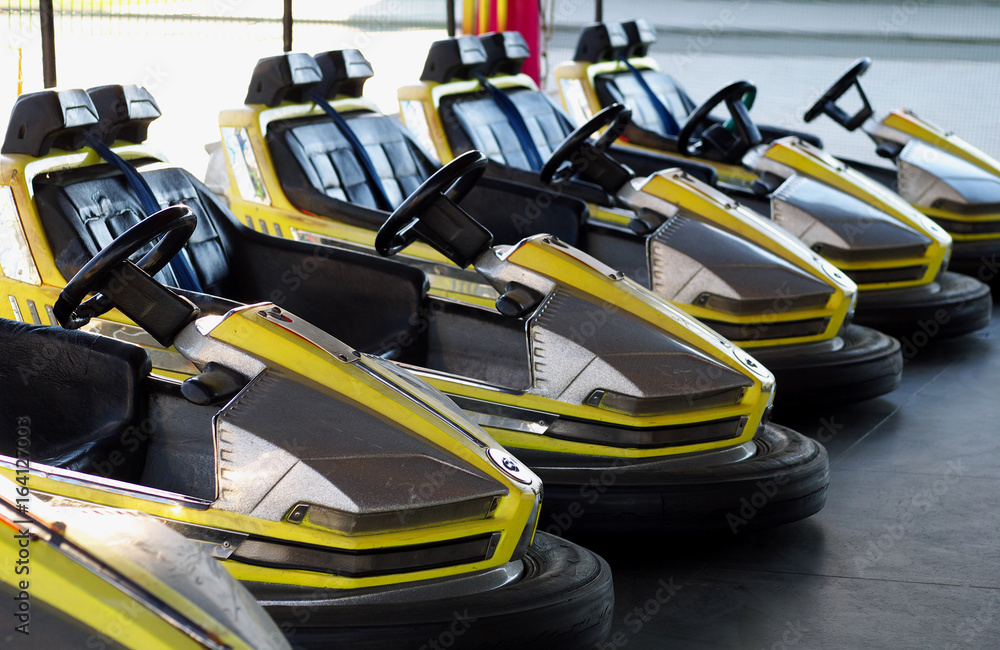 eelctric bumper cars in a row in amusement park eelctric bumper cars in a row in amusement park