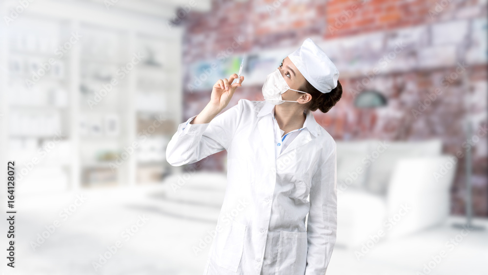Beautiful medical woman doctor in uniform. Studio painted background. Concept of profitable health care. Beautiful medical woman doctor in uniform. Studio painted background. Concept of profitable health care.