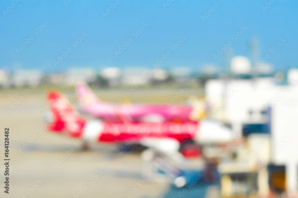 Blurred airplanes parking at the airport Blurred airplanes parking at the airport
