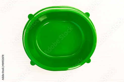 green empty plastic bowl for feeding animals