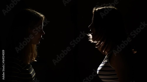 Two girls angry with each other. Anger, quarrel, violence. Unhappy mother and daughter or two sisters, family issues.