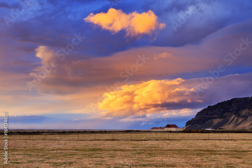 Wallpaper Mural Beautiful vibrant sunset over a farm in the wide landscape of Iceland  Torontodigital.ca