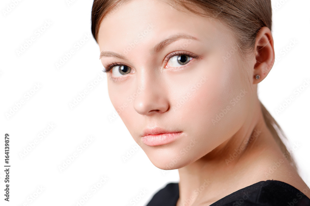 Beautiful woman face close up studio on white Beautiful woman face close up studio on white