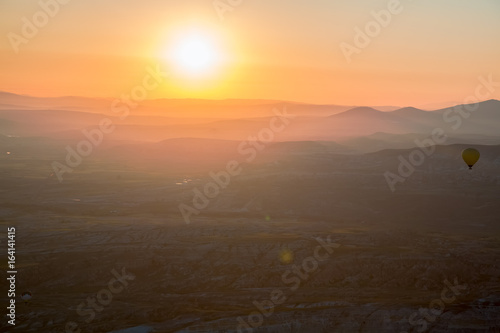 Hot air balloon flying over spectacular Cappadocia © slava2271