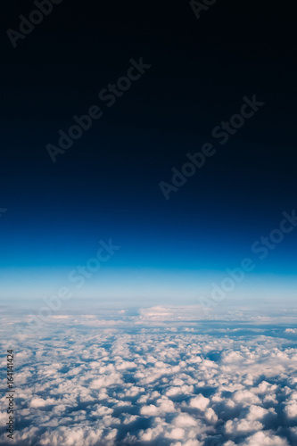Breathtaking view of clouds in the stratosphere and clean dark blue sky space in the top