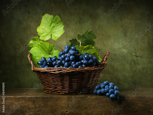 Still life with grapes in a basket