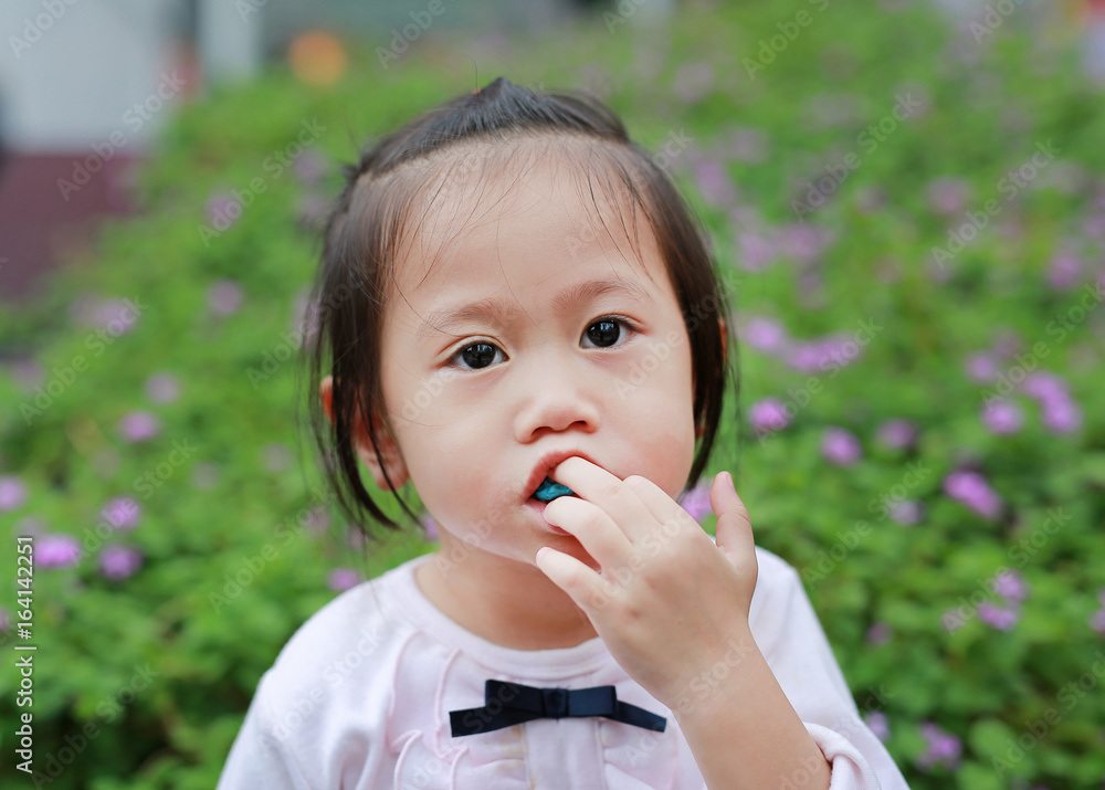 Cute little girl enjoy eating bubble gum. Cute little girl enjoy eating bubble gum.