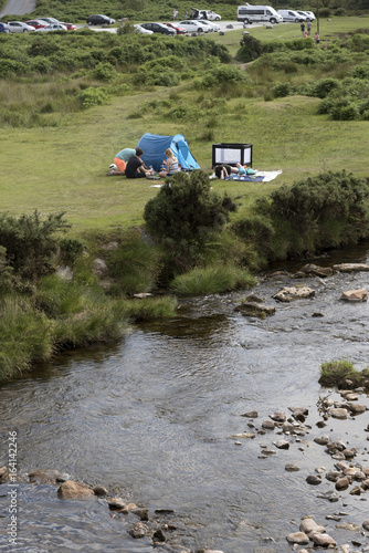 The River Plym in the Dartmoor National Park in Devon UK. Tourists alongside the river in this famous National Park photo