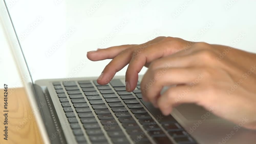 Women's hands typing on computer keyboard Women's hands typing on computer keyboard