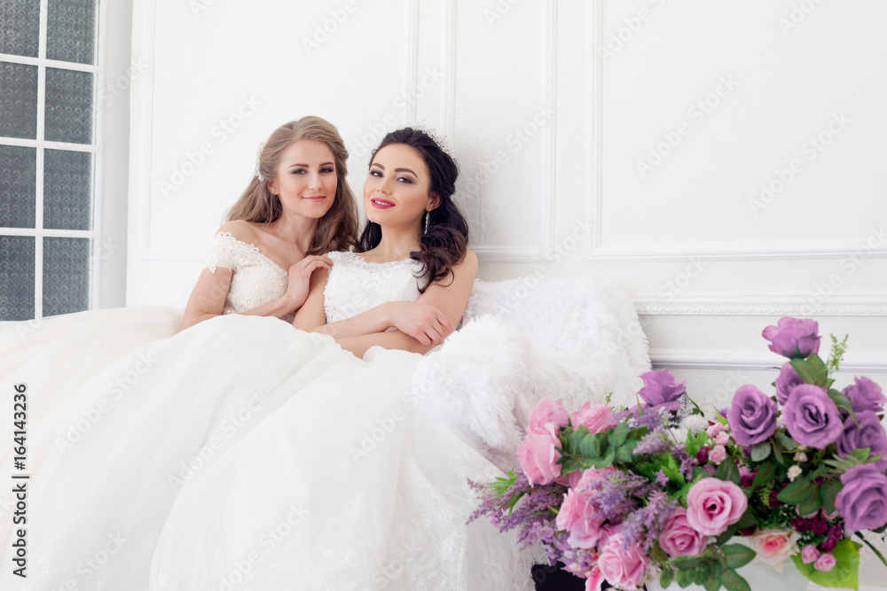 two brides on wedding wedding blonde brunette girlfriend