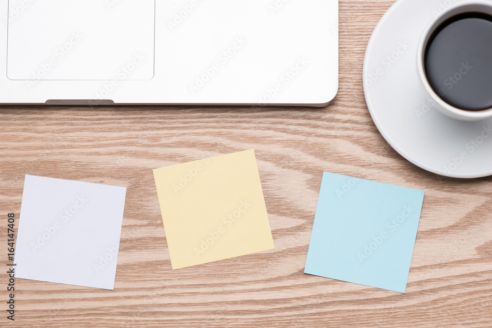 Laptop with colorful stickers on wooden table. Laptop with colorful stickers on wooden table.