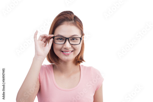 Portrait of a young cheerful asian woman in glasses