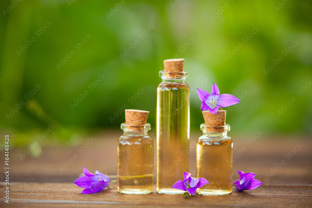 Essence of flowers on table in beautiful glass jar Essence of flowers on table in beautiful glass jar