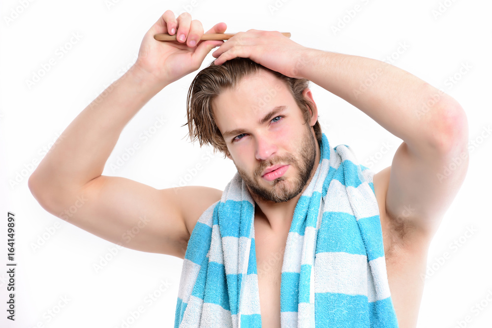 Bathing and morning time concept. Man with naked torso Bathing and morning time concept. Man with naked torso