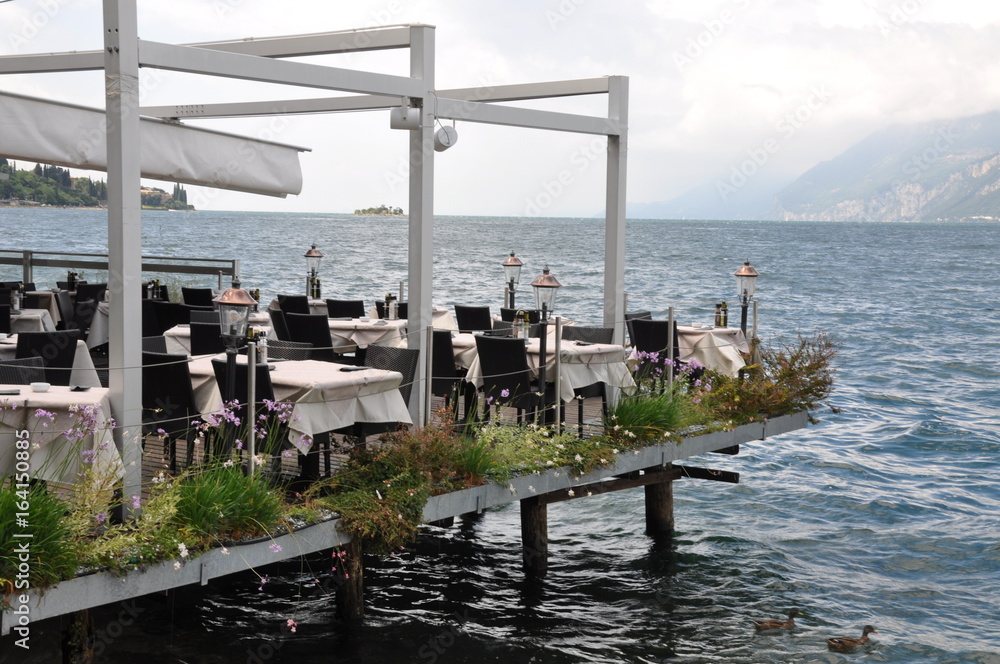 Outdoor restaurant on the lake Garda Italy