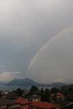 Big rainbow over Mount Sasso del Ferro at Lake Maggiore view from Stresa, Piedmont Italy