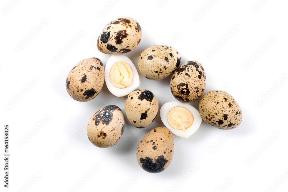 group of quail eggs isolated on white background. top view