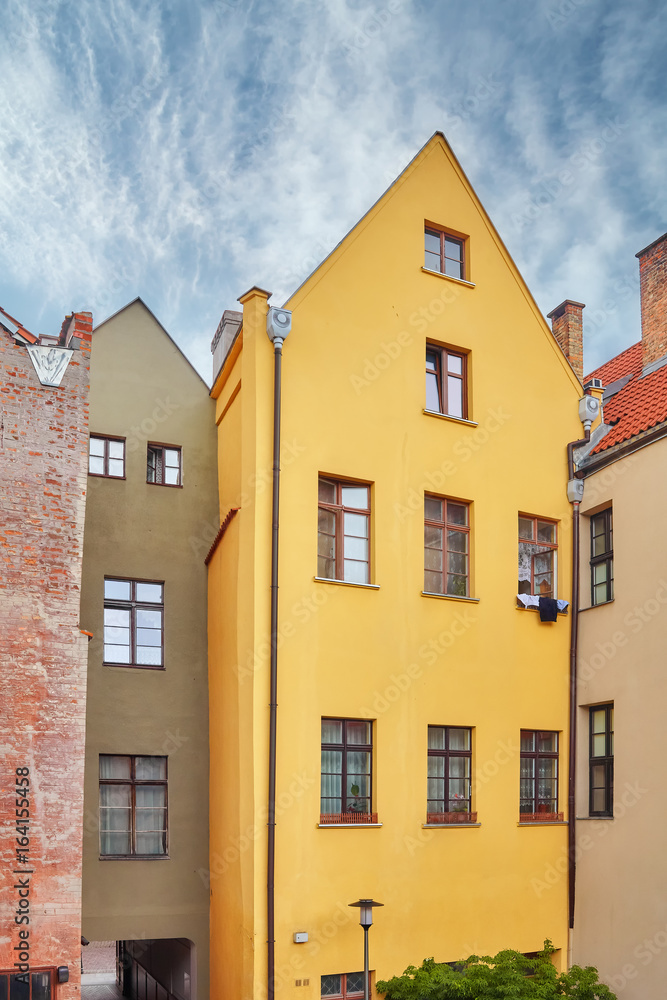 Facades of tenement houses in Torun old town, Poland.