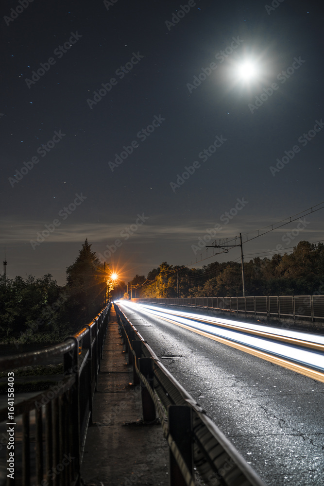 Light trails under the moon Light trails under the moon