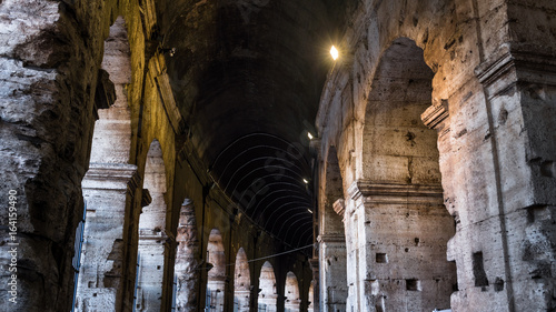 Photography Illuminated circular galleries of Colosseum in Rome, Italy