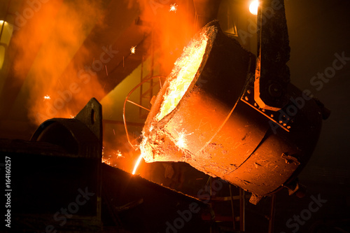 Working in a foundry. Shallow doff. See more images and video from this series. photo