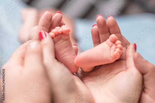 Baby feet in mother hands