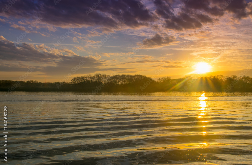 Beautiful Sunrise in the coast of Lujan River in San Fernando, Buenos Aires. San Fernando is the Argentine capital of Nautical Beautiful Sunrise in the coast of Lujan River in San Fernando, Buenos Aires. San Fernando is the Argentine capital of Nautical