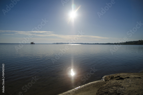 Sun light and a deep blue lake natural backgound wallpaper