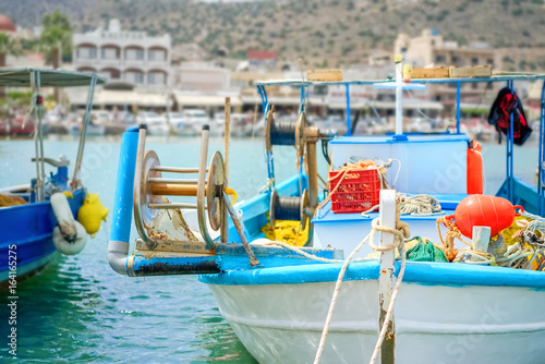 Wooden fishing boat moored in Agios Nicolaos harbor in Crete