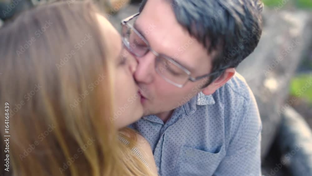 Boyfriend and girlfriend, loving couple walking and kissing at sunset in rural mestres on nature Boyfriend and girlfriend, loving couple walking and kissing at sunset in rural mestres on nature
