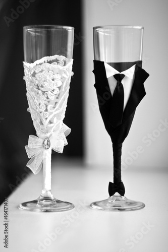 Two decorated champagne glasses for a wedding party