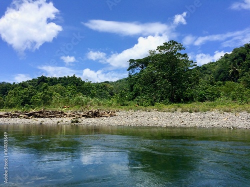 Bamboo Rafting On The Beautiful Tropical Rio Grande River In The Sunny Portland Parish Of The Island Of Jamaica Caribbean On A Summer Day With Cloudy Blue Sky Stock Photo Adobe Bamboo Rafting On The Beautiful Tropical Rio Grande River In The Sunny Portland Parish Of The Island Of Jamaica Caribbean On A Summer Day With Cloudy Blue Sky Stock Photo Adobe