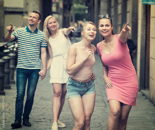 two young girls walking on urban street . © JackF