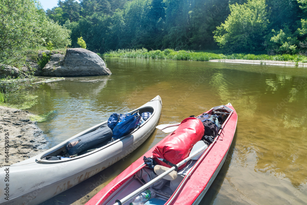 Two kayaks standing in water Two kayaks standing in water