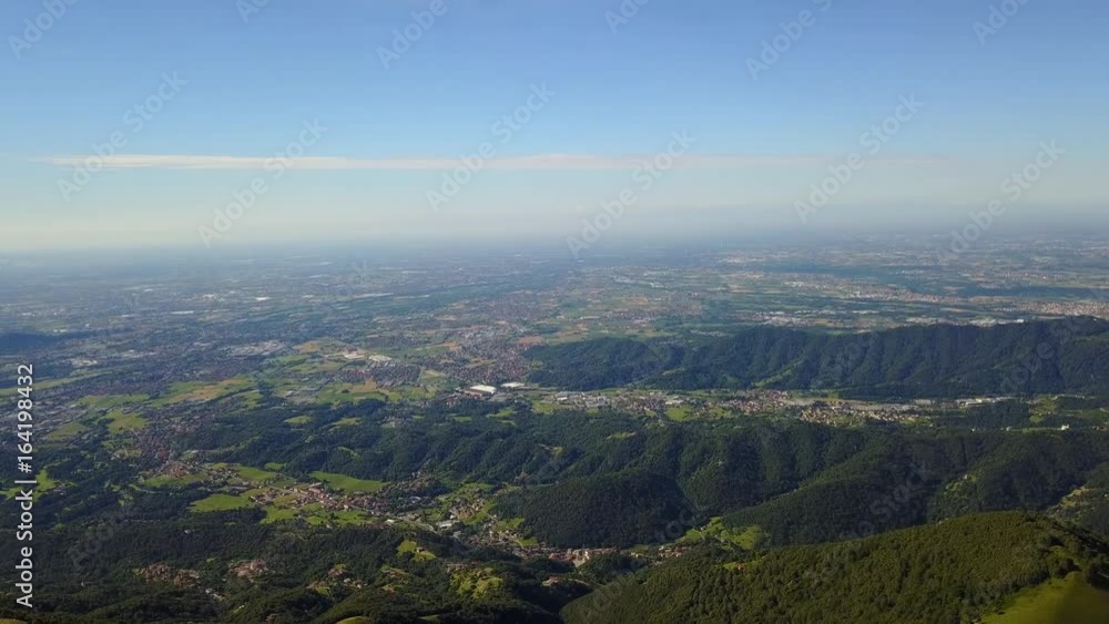 Superb 360° landscape on the Padana plain and Alps in summer time. Panorama from Linzone Mountain, Bergamo, Italy Superb 360° landscape on the Padana plain and Alps in summer time. Panorama from Linzone Mountain, Bergamo, Italy