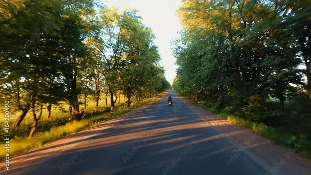 Aerial: the hills of the Carpathians, the camera follows a motorcyclist on the highway, having fun and enjoying the road Aerial: the hills of the Carpathians, the camera follows a motorcyclist on the highway, having fun and enjoying the road