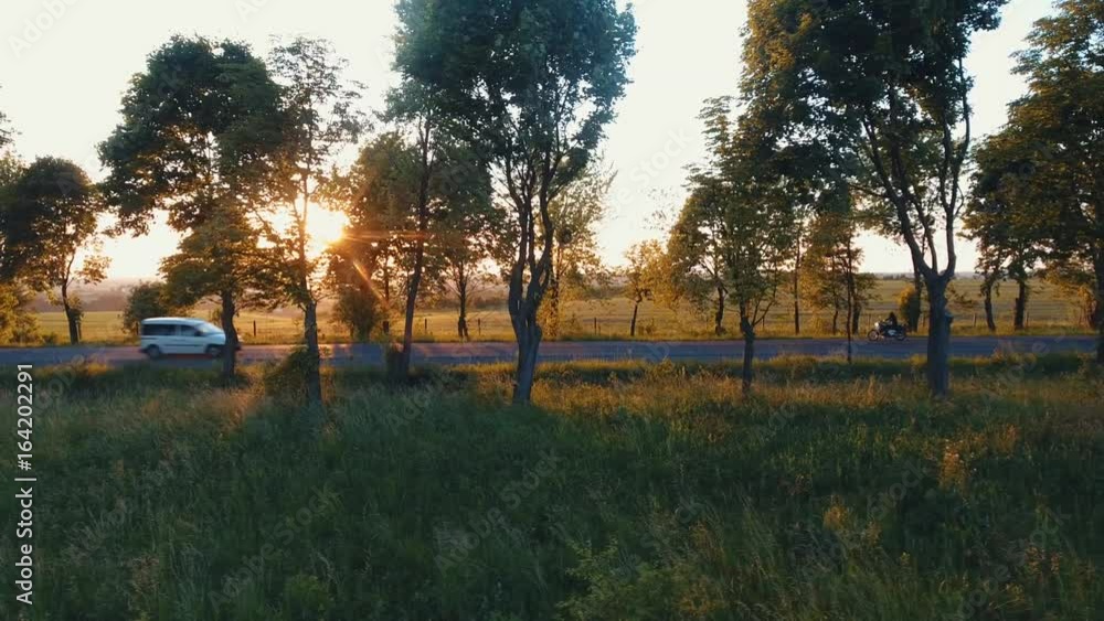 Aerial: the hills of the Carpathians, the camera follows a motorcyclist on the highway, having fun and enjoying the road Aerial: the hills of the Carpathians, the camera follows a motorcyclist on the highway, having fun and enjoying the road