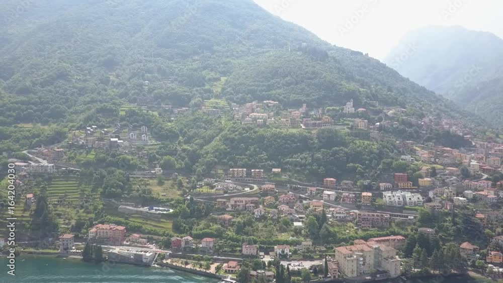 LAKE COMO, ITALY from the drone and the Italian Alps in background LAKE COMO, ITALY from the drone and the Italian Alps in background