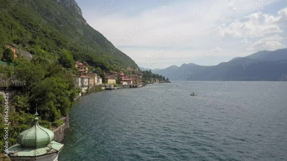 LAKE COMO, ITALY from the drone and the Italian Alps in background LAKE COMO, ITALY from the drone and the Italian Alps in background