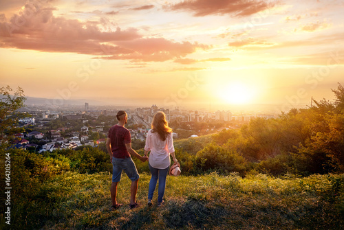 Couple at sunset city view