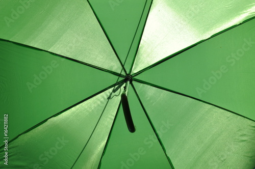 Striped umbrella background view from below