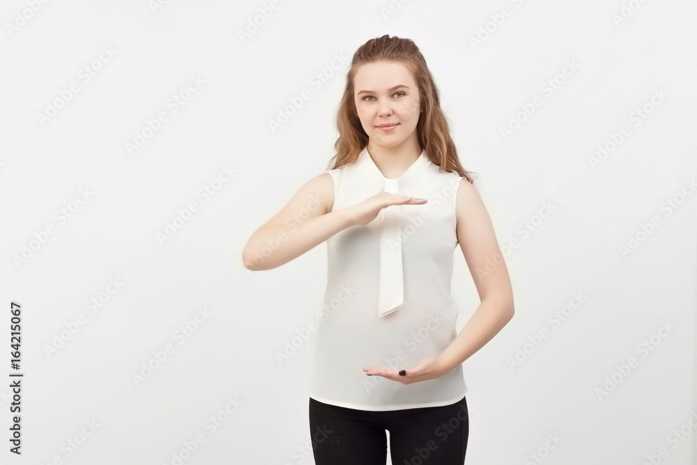 Portrait of young woman pointing hands finger at corner with copyspace isolated on a white background.Woman with finger point up Portrait of young woman pointing hands finger at corner with copyspace isolated on a white background.Woman with finger point up