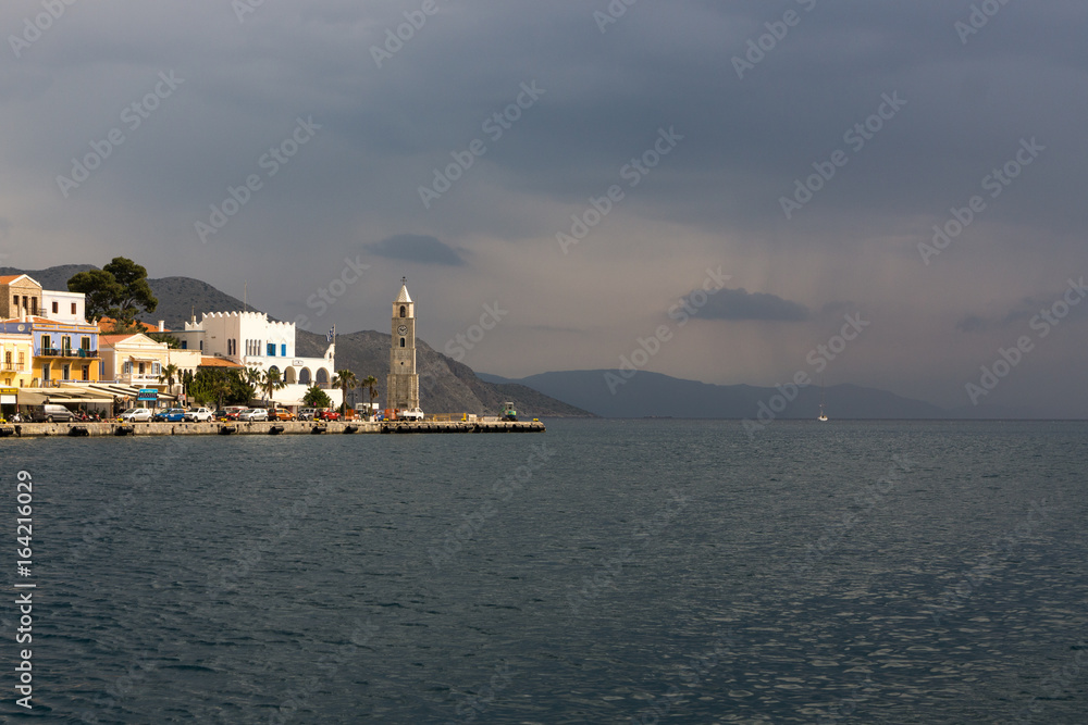 Gulf in small typical island Symi with bright houses in Greece