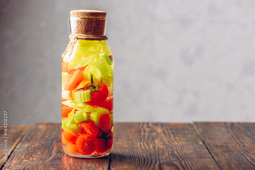 Bottle Of Water with Tomato and Celery. Bottle Of Water with Tomato and Celery.