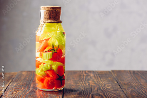 Bottle Of Water with Tomato and Celery.