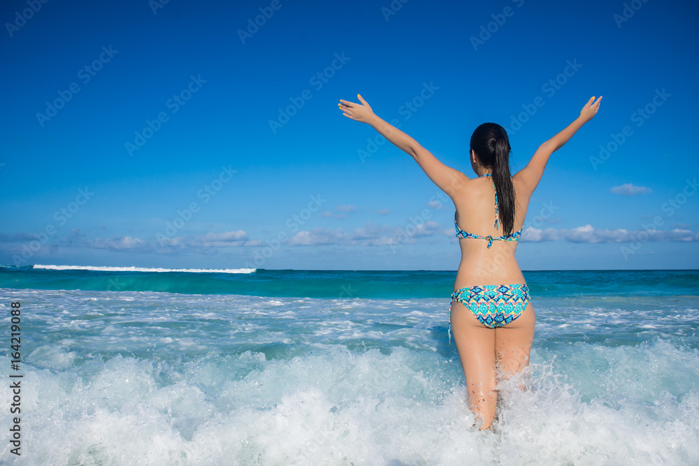 Young girl enjoying her vacations in Cancun beach, Mexico Young girl enjoying her vacations in Cancun beach, Mexico