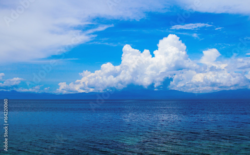 Sea landscape with clouds. Turquoise blue seascape.