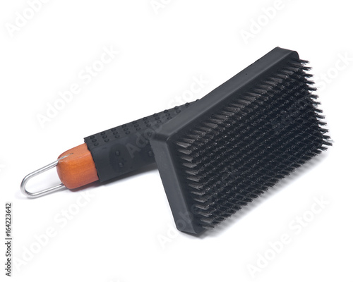 Grill brush with metal bristles isolated on white background