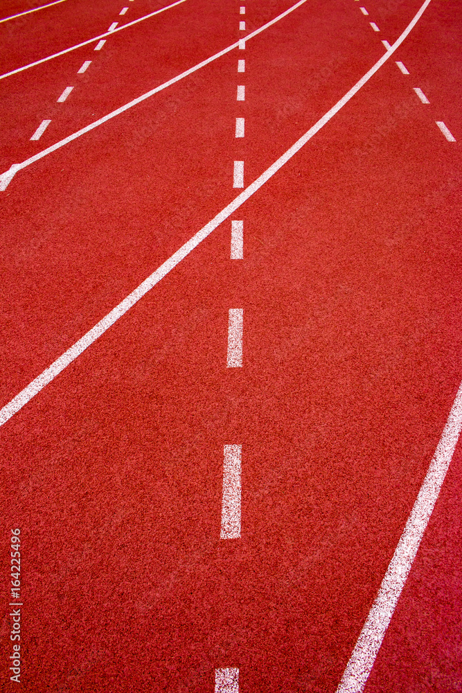 Red running track Synthetic rubber on the athletic stadium.