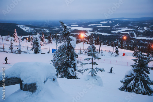Beautiful cold mountain view of ski resort, sunny winter day with slope, piste and ski lift 